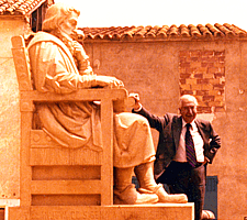 Prof. Grande Covián poses beside the statue of Michael Servetus the day he joined the Michael Servetus Institute.